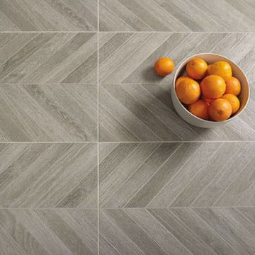 Smoke Rectangle Chevron chocolate brown engineered porcelain tile on bathroom shower wall, 18x35