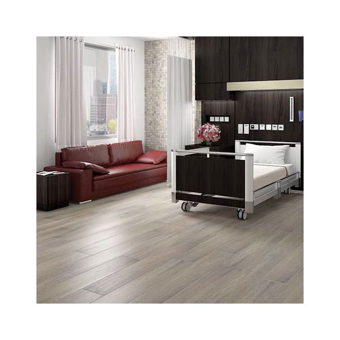 A floor covered with brown porcelain tiles that resemble balsam fir wood planks