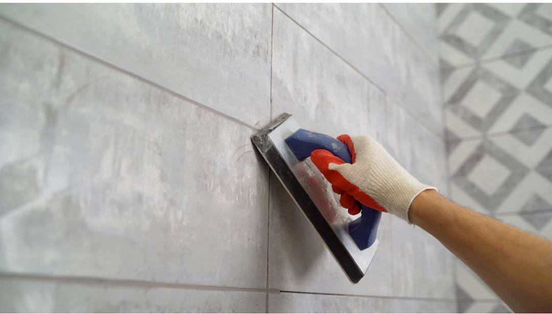 An image showing how grout lines are applied to subway tiles.