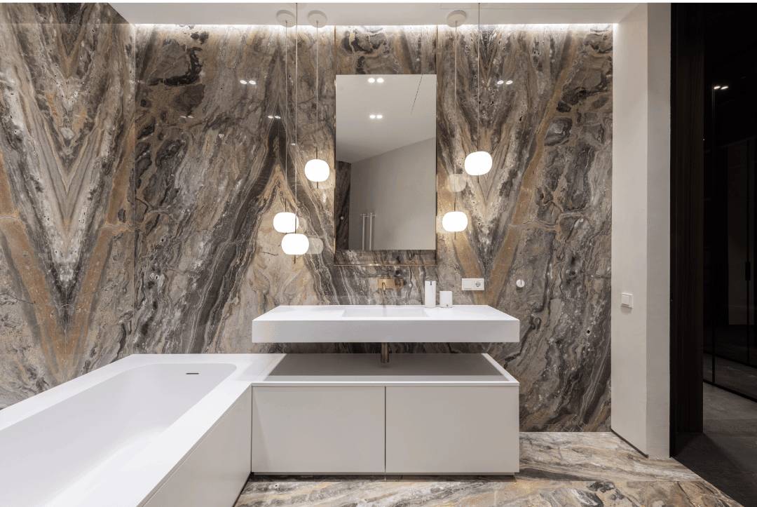 A modern bathroom with textured wall tiles and a white bathtub