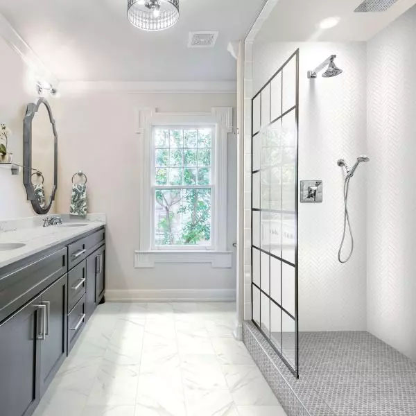 12x24 White Rectangle Porcelain Tile - A sleek and elegant bathroom in a white color scheme, with a wall and a sink composed of 12x24 matte porcelain tiles from the Rekindle Collection