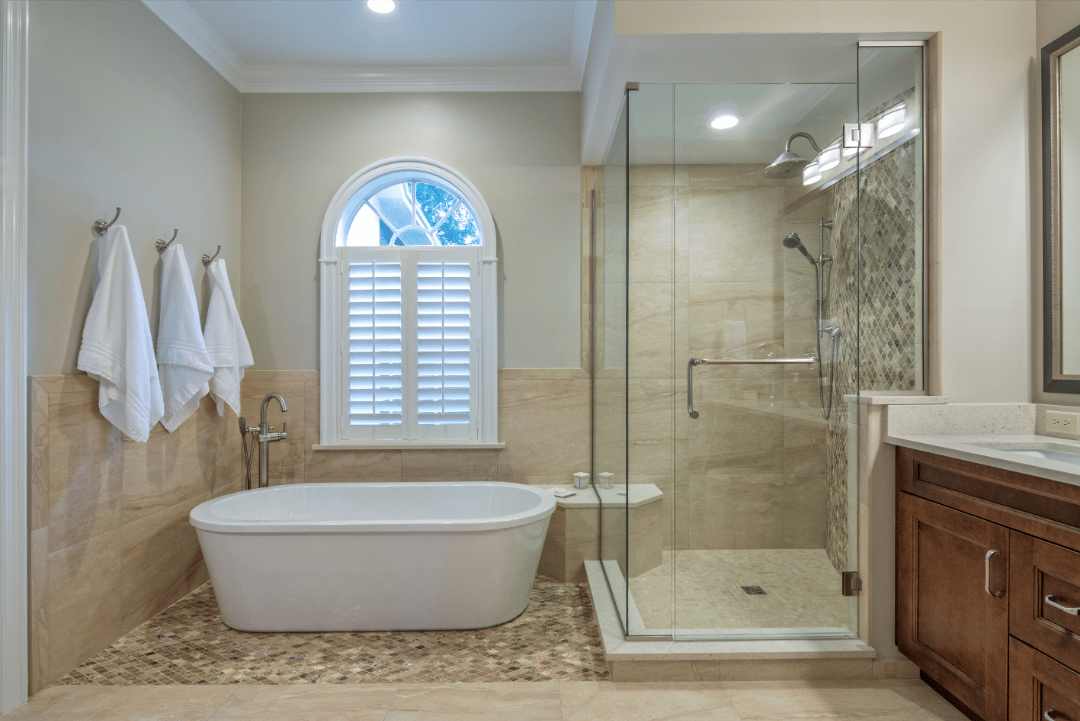 Textured floor tiles paired with travertine shower walls