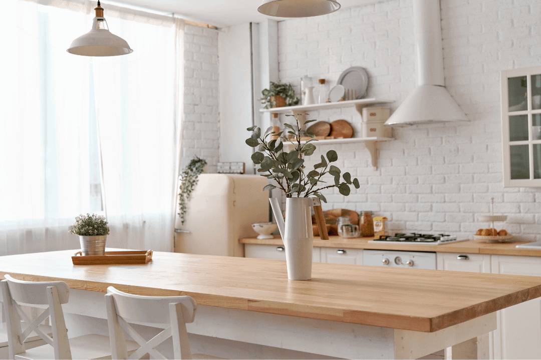 Kitchen wall and backsplash made with white travertine Image source