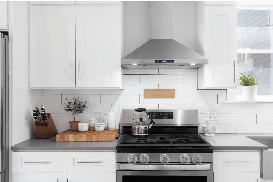 Modern kitchen with long white subway backsplash tiles and black grouting
