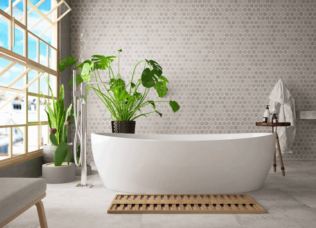 A Scandinavian bathroom with mosaic porcelain wall tiles and a white bathtub