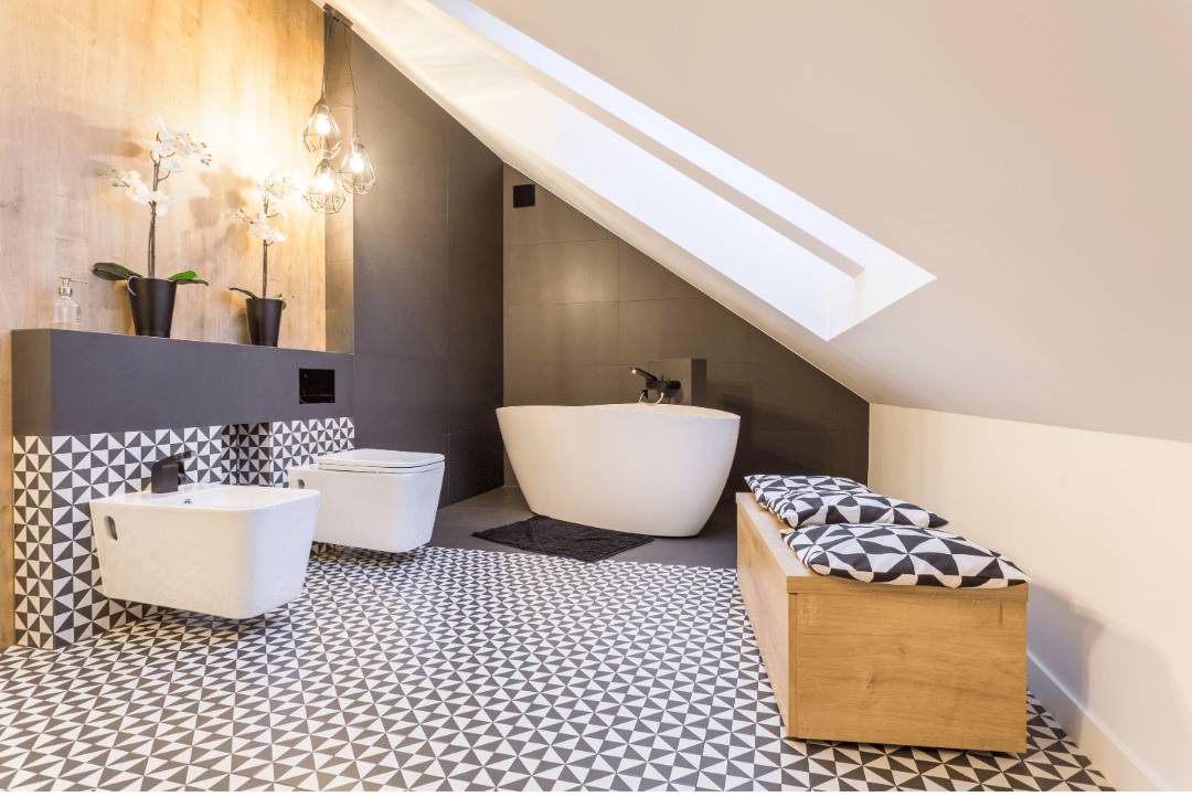 Bold black and white geometric floor tile patterns on a modern bathroom space