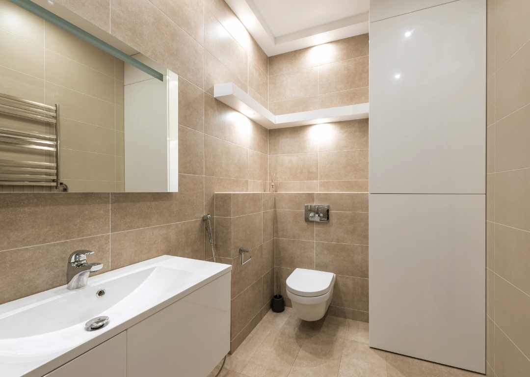 Large format travertine tiles on a bathroom wall and floor