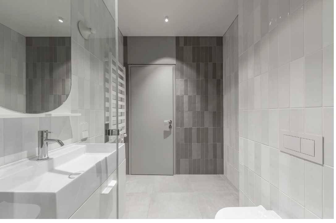 Modern bathroom with white monochrome walls and tiles