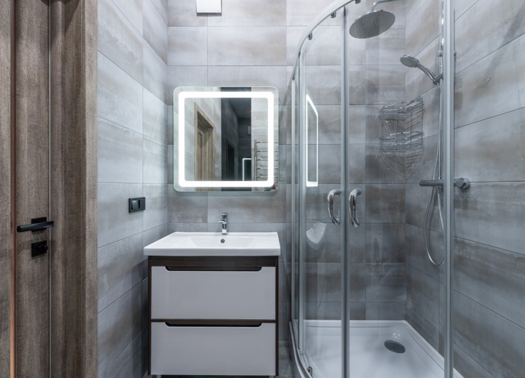 A modern bathroom with metallic-looking wall accents.