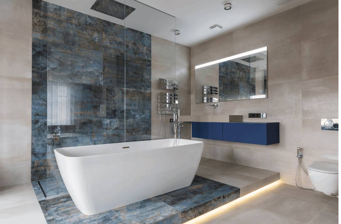 Textured wall and floor tiles blending seamlessly with a white bathtub